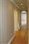 Hallway leading to Laundry Room on Left, Master Bedroom Suite, and Kitchen on Right